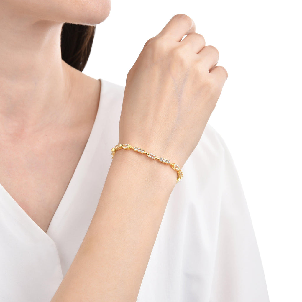 Elegant model hand showcasing the intricate details of our Topaz bracelet Gold plated bracelet Office Wear bracelet Birthday gift forher diamond bracelet Anniversary Gift engagement gift 18k gold bracelet bridal shower gift bridesmaid gift yellow gold jewelry dainty bracelet wedding bracelet