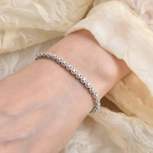 Load image into Gallery viewer, Elegant model hand showcasing the intricate details of our Tennis Moissanite Bracelet,silver bracelet