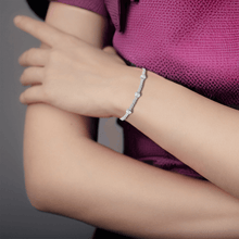 Load image into Gallery viewer, Elegant model hand showcasing the intricate details of our Natural White Zircon Bracelet Sterling Silver Dainty Bracelet 