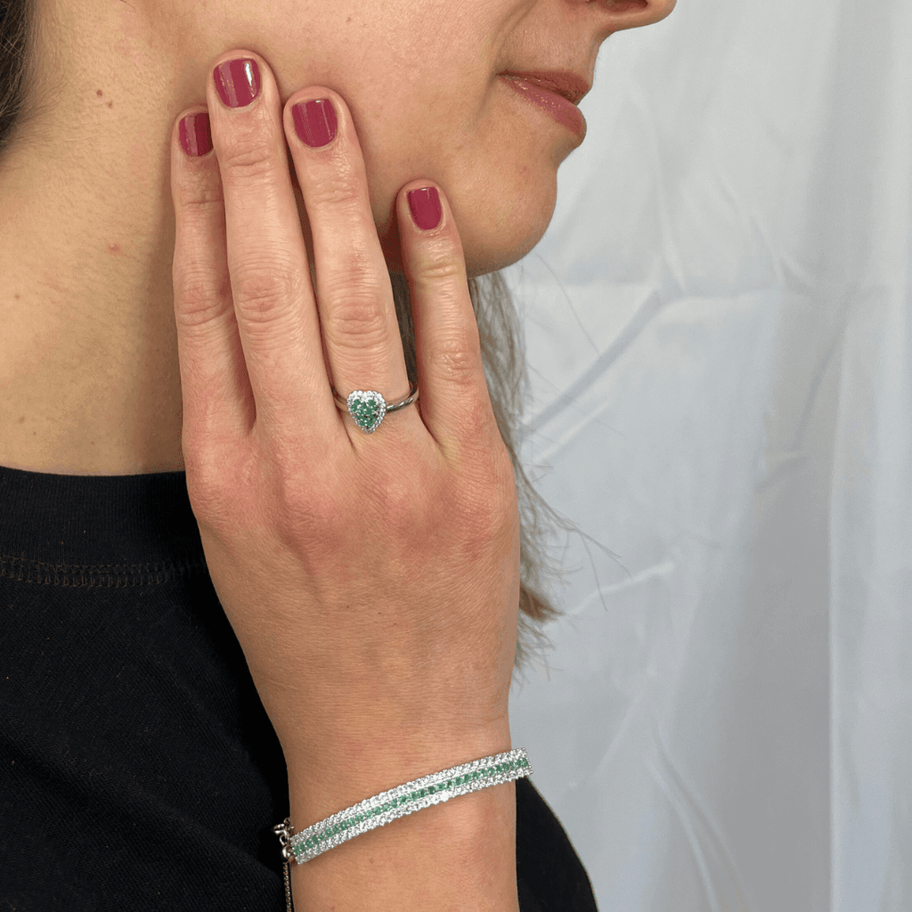 Elegant model hand showcasing the intricate details of ourEmerald Cuff Bracelet - FineColorJewels