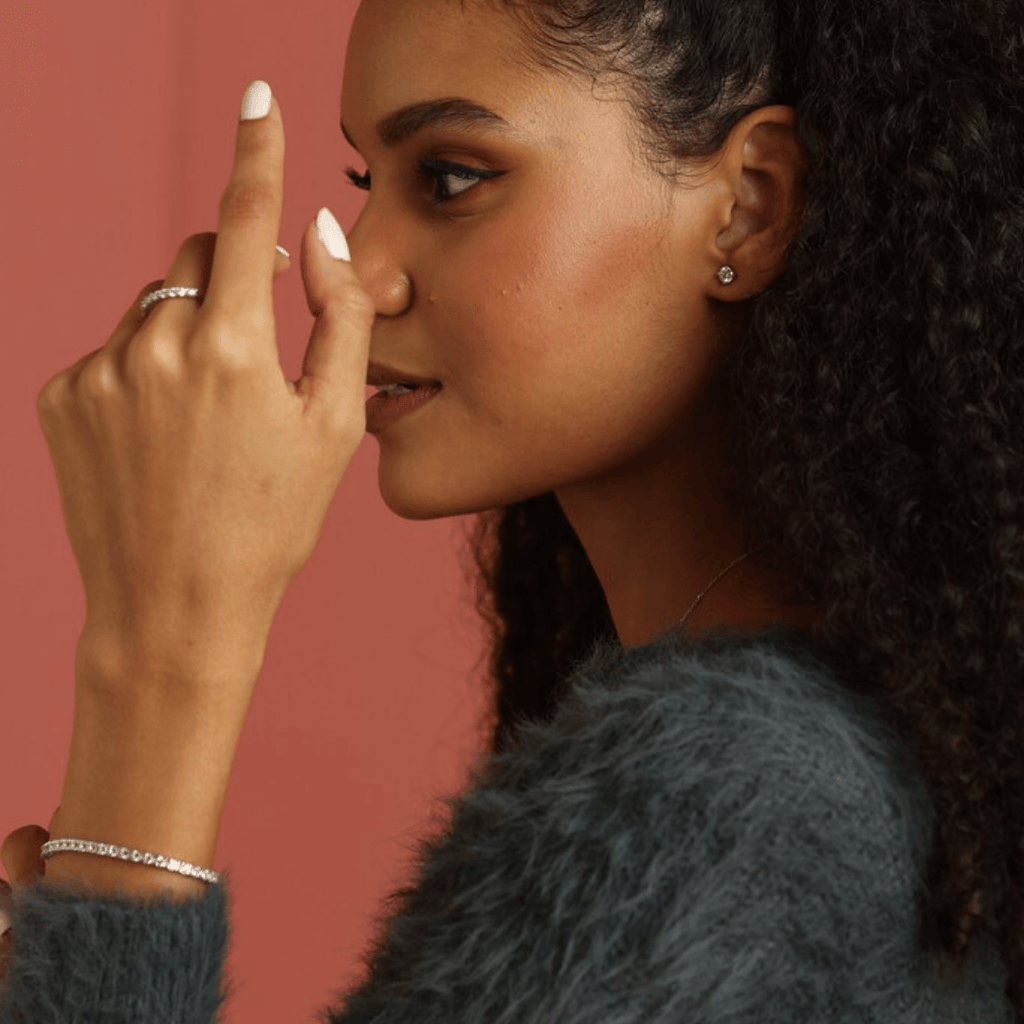 Elegant model hand showcasing the intricate details of Dainty Lab Grown White Sapphire Minimalist Bracelet