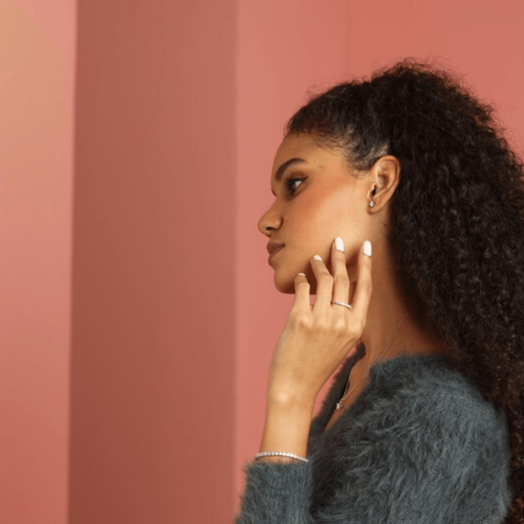 Elegant model hand showcasing the intricate details of our silver Tennis Bracelet