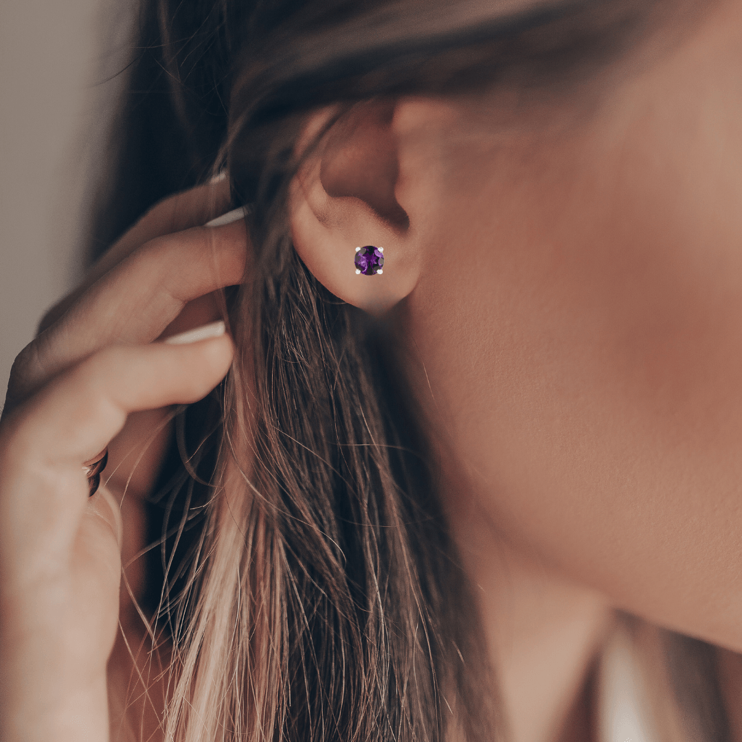 Model showcasing  amethyst February Birthstone Gemstone Studs