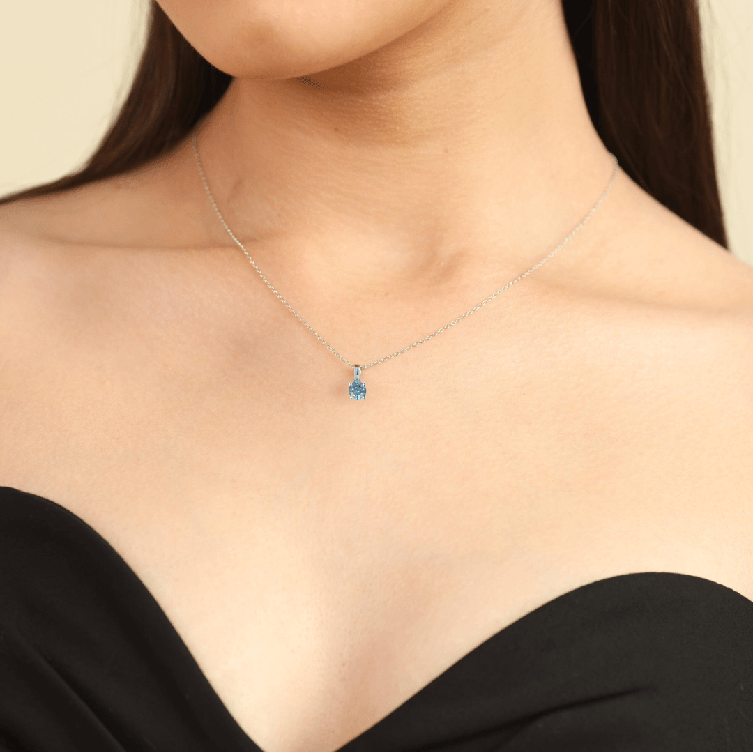 model showcasing moissanite necklace white moissanite pendant necklace silver necklace affordable jewelry gift idea for her minimalist pendant minimalist necklace blue gemstone blue silver pendant diamond necklace gift from daughter mothers day jewelry