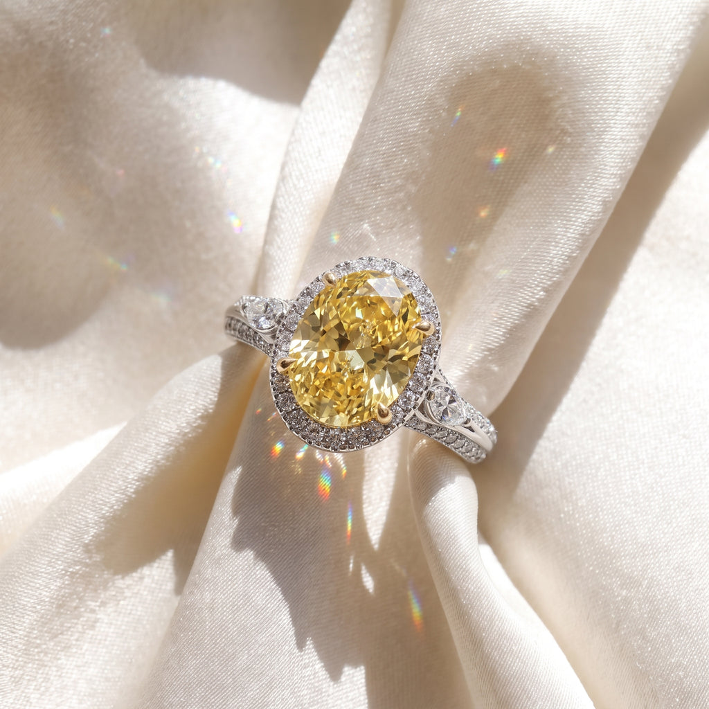 3Cttw Oval Shaped Yellow Lab Grown Diamond (F/VS) Three Stone Halo Engagement Ring in 14K Gold