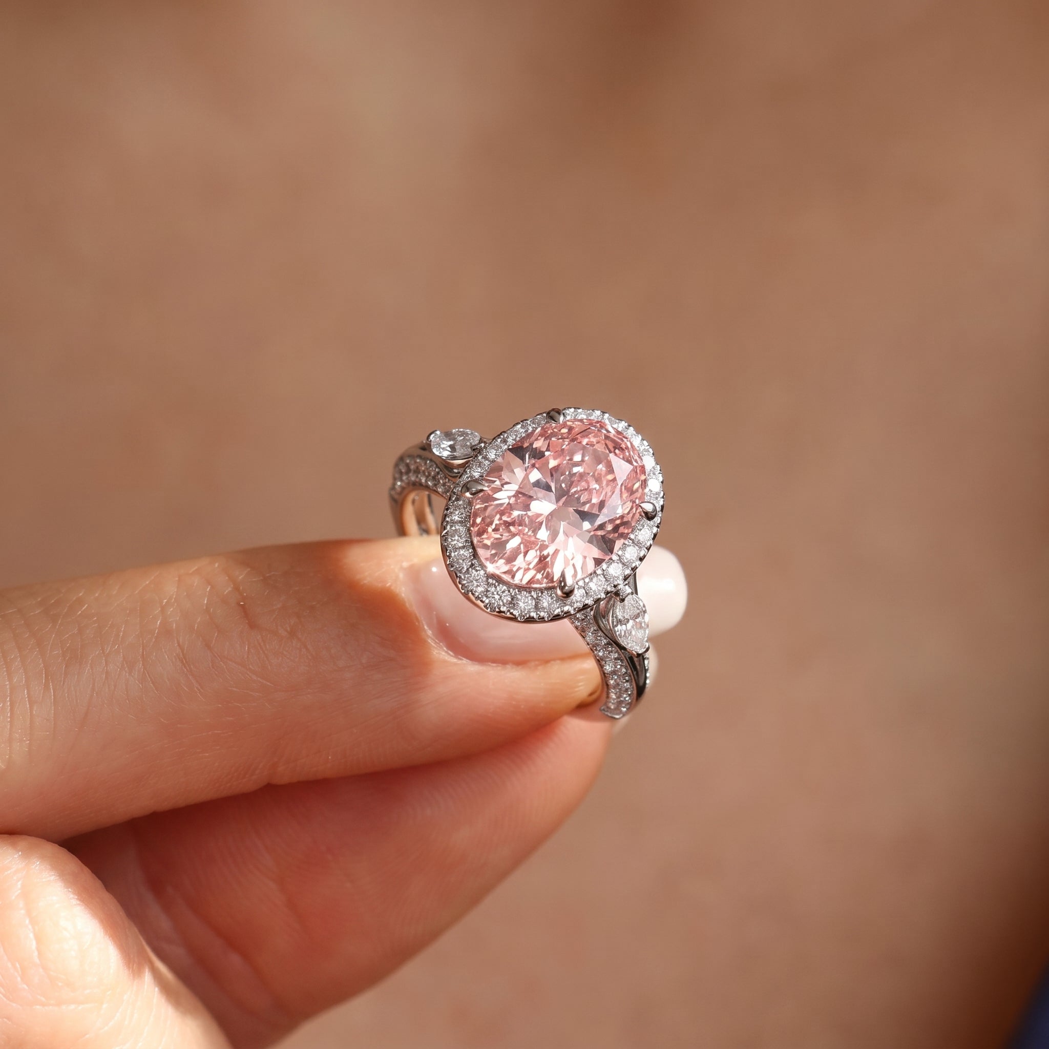 3Cttw Oval Shaped Pink Lab Grown Diamond (F/VS) Three Stone Halo Enagement Ring in 14K Gold