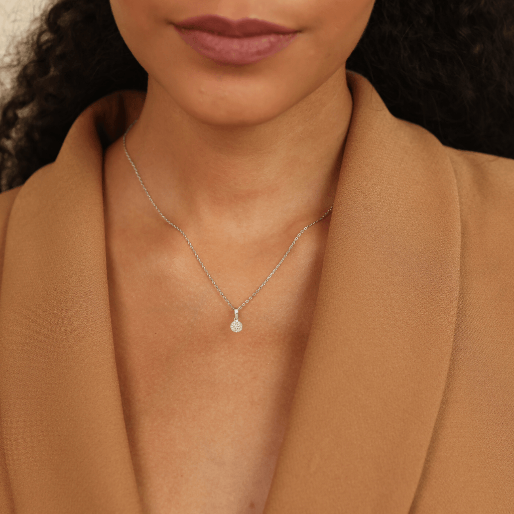 model wearing white gold diamond pendant