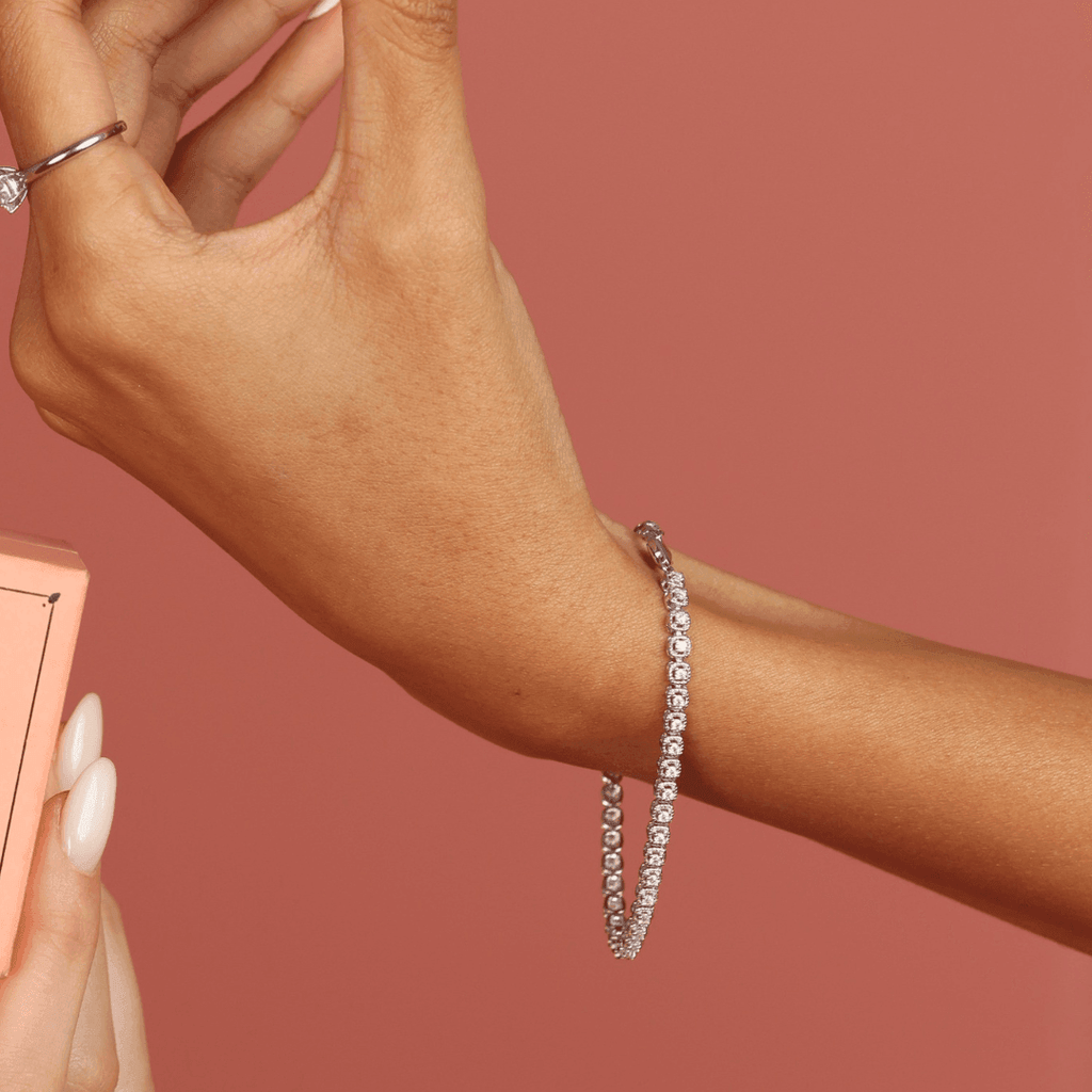 Elegant model hand showcasing the intricate details of ourMoissanite Round Bracelet,Halo Style Moissanite Bracelet,Work Wear Bracelet - FineColorJewels