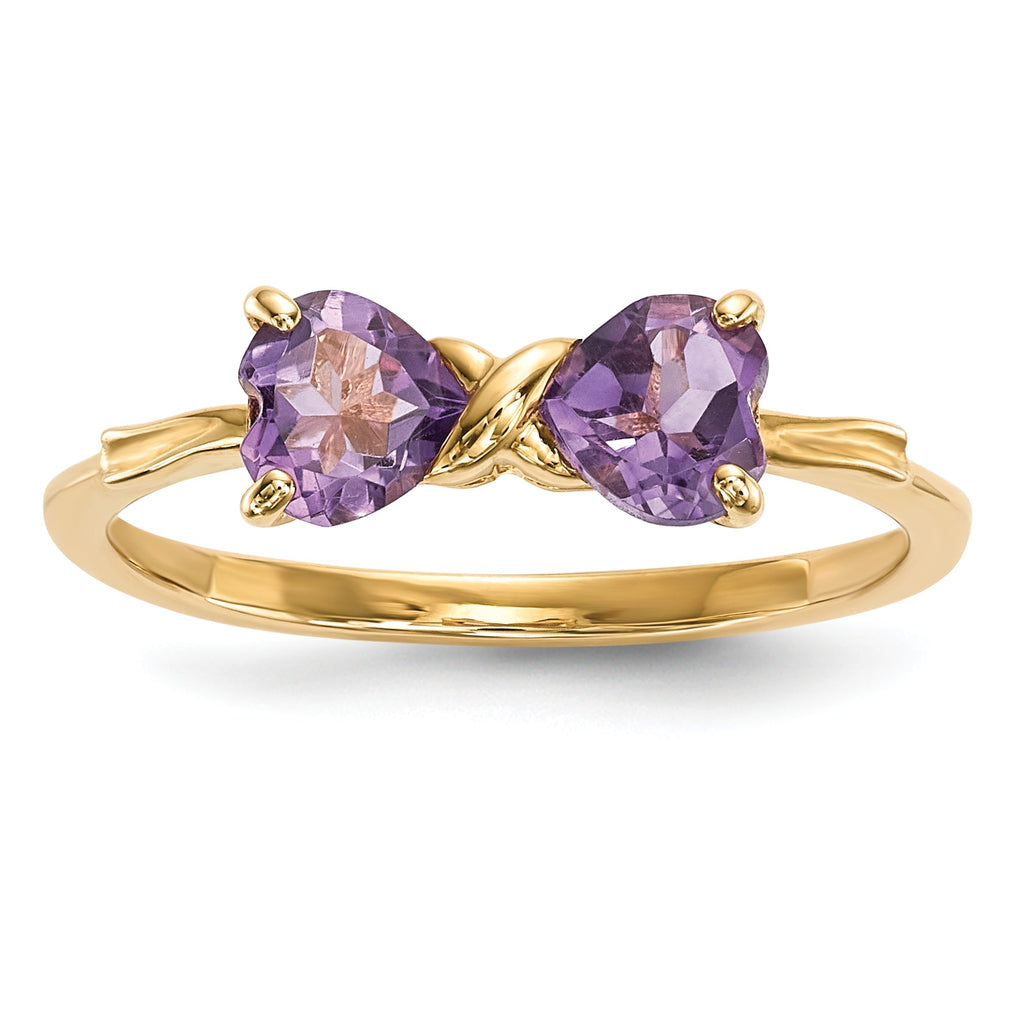 Gold ring with two heart-shaped purple gemstones, handcrafted fine jewelry design