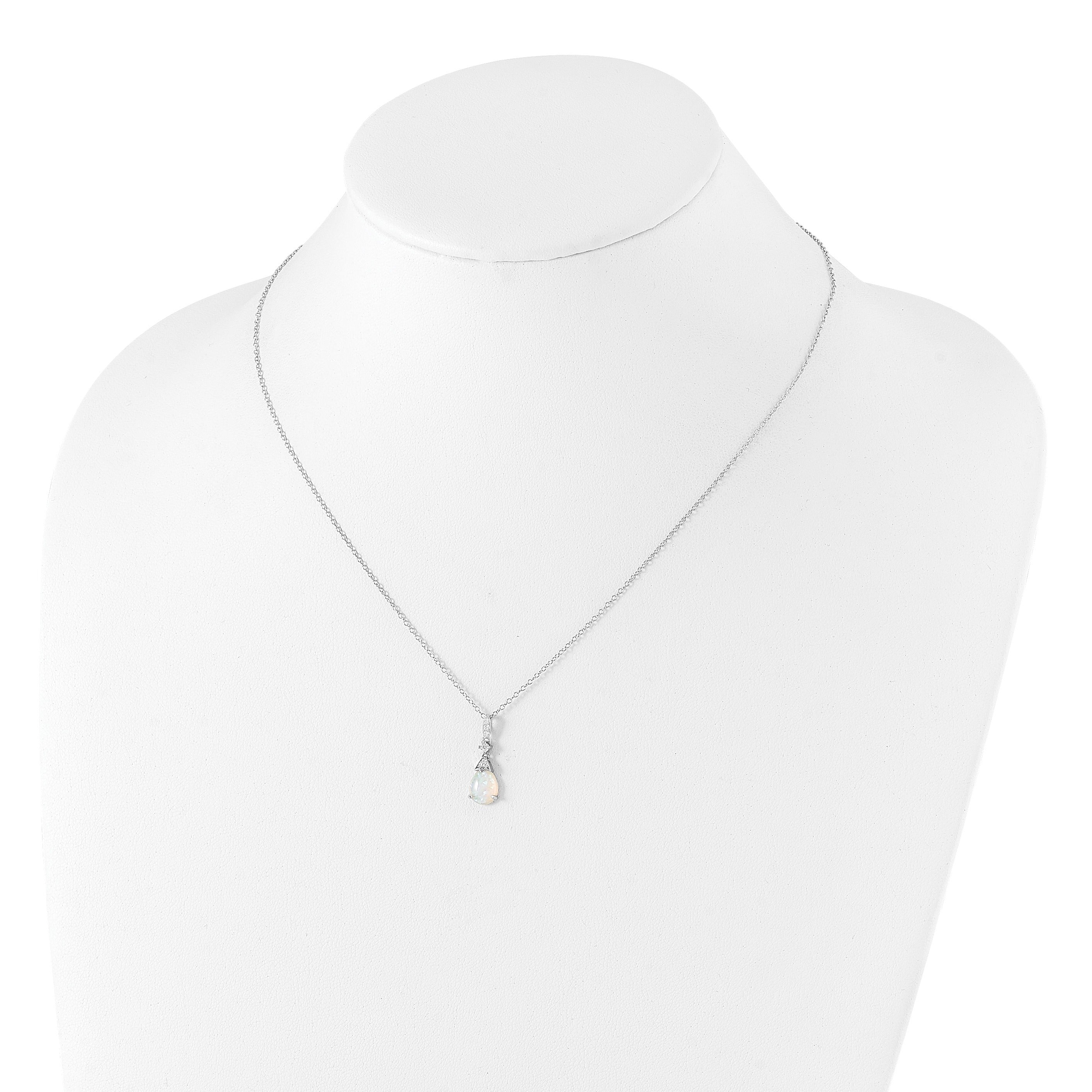 Delicate silver necklace with teardrop gemstone pendant on white jewelry display, FCJ Jewelry LLC