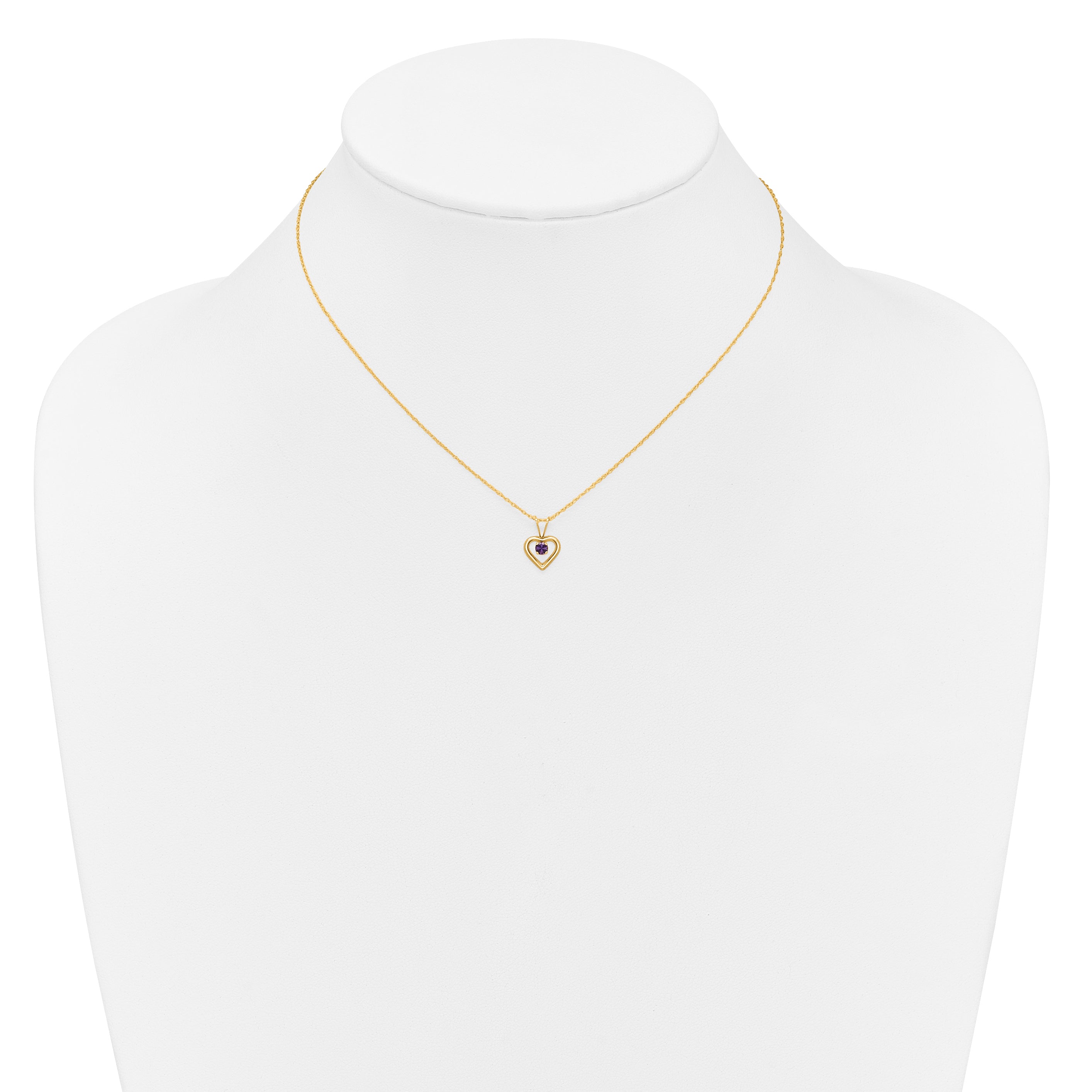 Gold heart pendant necklace with purple gemstone on display, handcrafted fine jewelry USA