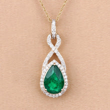 Load image into Gallery viewer, Genuine Zambian Emerald and White Diamond 14K Gold Crossover Pendant