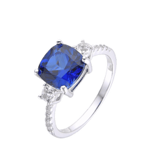 Load image into Gallery viewer, Lab Grown Cushion Cut Blue Sapphire Statement Engagement Ring with White Topaz Accents -September Birthstone White Rhodium-Plated 925 Sterling Silver - FineColorJewels