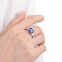 Load image into Gallery viewer, Lab Grown Cushion Cut Blue Sapphire Statement Engagement Ring with White Topaz Accents -September Birthstone White Rhodium-Plated 925 Sterling Silver - FineColorJewels