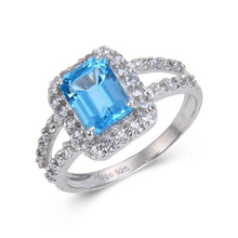 Load image into Gallery viewer, Sterling Silver Blue Topaz Ring accentd with White Topaz.
$ 50 – 100, 6, 7, 8, Blue, Emerald Cut/Octagon, Blue Topaz, White Topaz, 925 Sterling Silver, Fashion